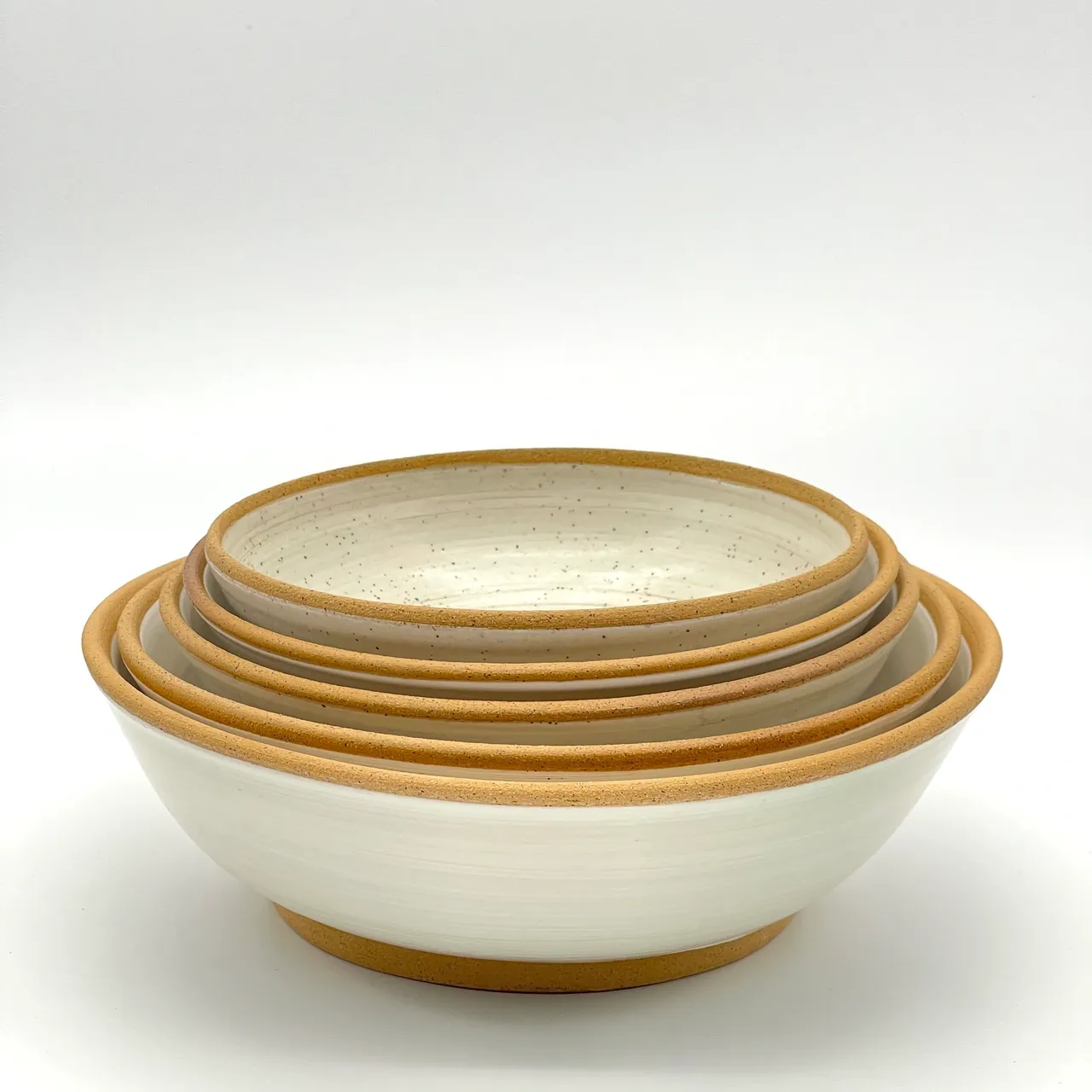 A bowl and two bowls are stacked on top of each other.